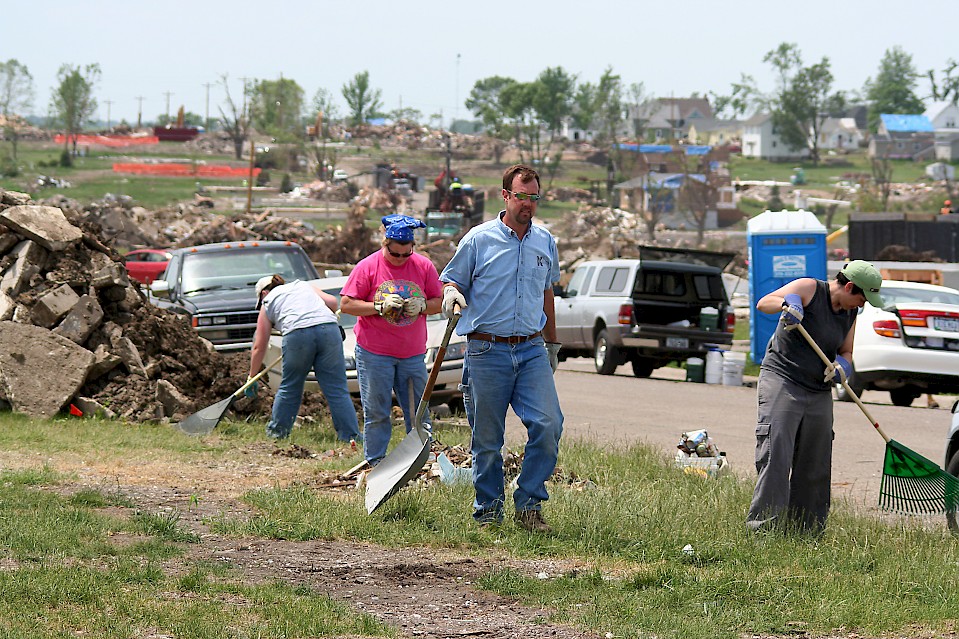 Volunteers help to clean up a neighborhood in Iowa