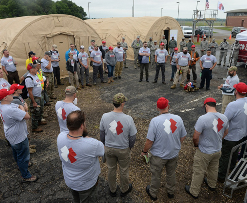 Team Rubicon, members of the National Guard Bureau and debris removal teams attend operational briefing at PATRIOT North 16’
